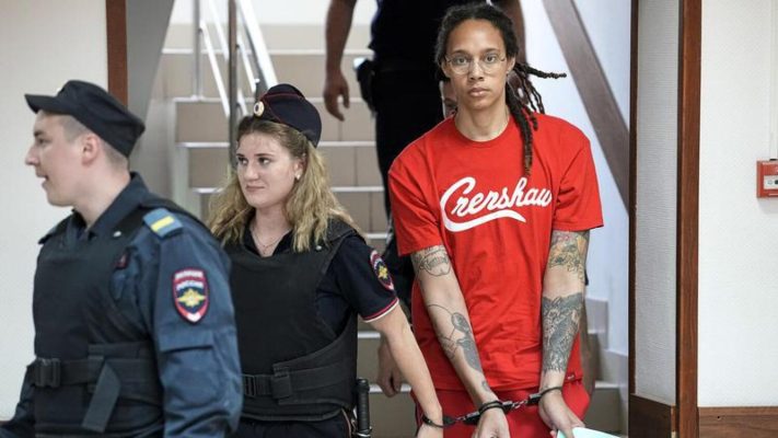 Brittney Griner in handcuffs following legal proceedings